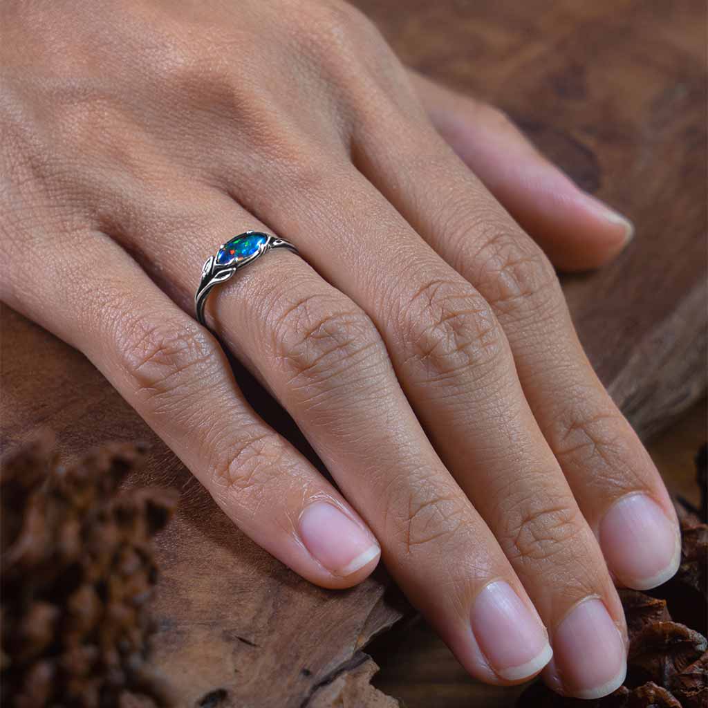 opal engagement ring on womens hand