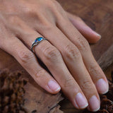 opal engagement ring on womens hand