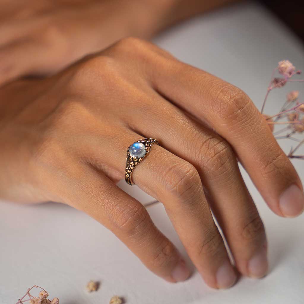 blue moonstone engagment ring on hand